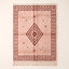 Full flat view of Blush & Rust Beni Ourain Damya rug with concentric diamond motif and bordered design