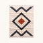 Ivory Beni Ourain rug with nested charcoal diamond borders and terracotta central diamond, flat lay on pale background