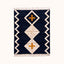Navy, ivory and gold Beni Ourain rug with diamond lattice and cross motif on plain background