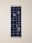 Navy and ivory Mrirt runner with grid check pattern, flat lay on white background