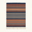 Navy Zanafi Kilim rug Ounila with layered rust and ivory stripes, full rug view