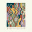 Full view of the Tafrar Boujaad rug in sage, terracotta, lilac and ochre with zigzag diamonds and abstract forms