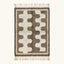 Full view of the Tazrout Beni Ourain rug with taupe abstract forms on an ivory ground and hand-tied fringe.