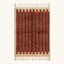 Full view of the Tifrit terracotta Beni Ourain rug with linear stripes and hand-tied fringe.