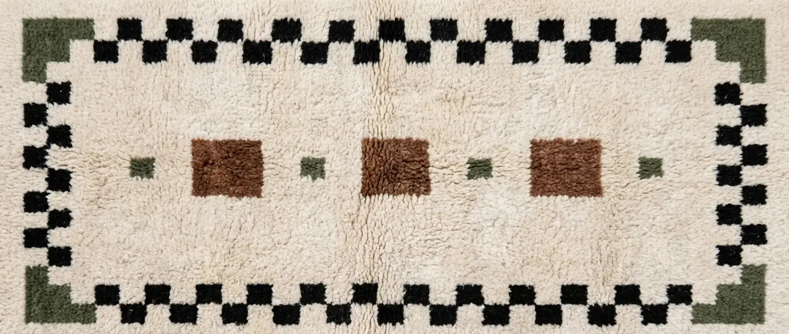 Handmade Moroccan wool rug with repeating geometric pattern