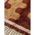Pattern detail of the Aderfi Beni Ourain rug with terracotta and camel abstract forms.