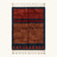 Full view of the Aksel rust Beni Ourain rug with a navy framed triangle motif and hand-tied fringe.