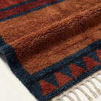 Aksel rust and navy Beni Ourain rug border and triangle motif detail