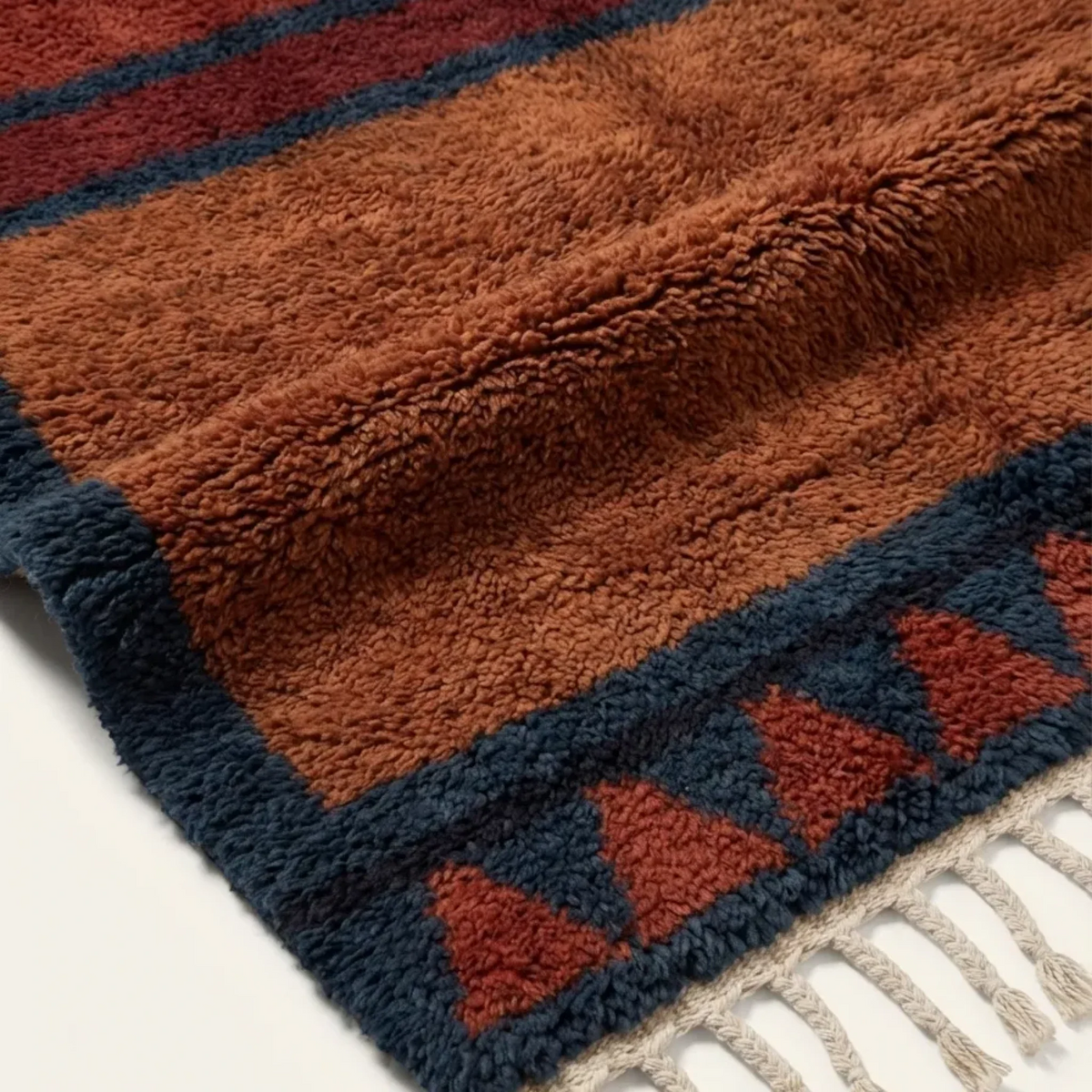 Aksel rust and navy Beni Ourain rug border and triangle motif detail