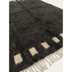 Additional detail view of the Amanar charcoal and ivory Beni Ourain rug.