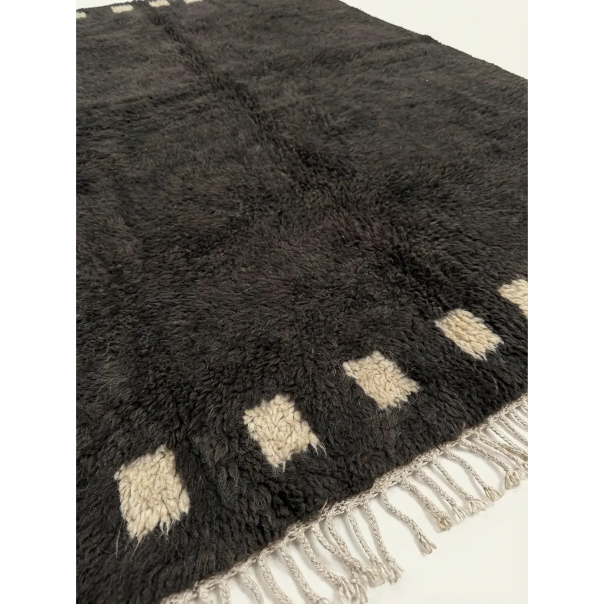 Additional detail view of the Amanar charcoal and ivory Beni Ourain rug.