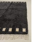 Soft natural wool pile detail of the Amanar charcoal Moroccan rug.