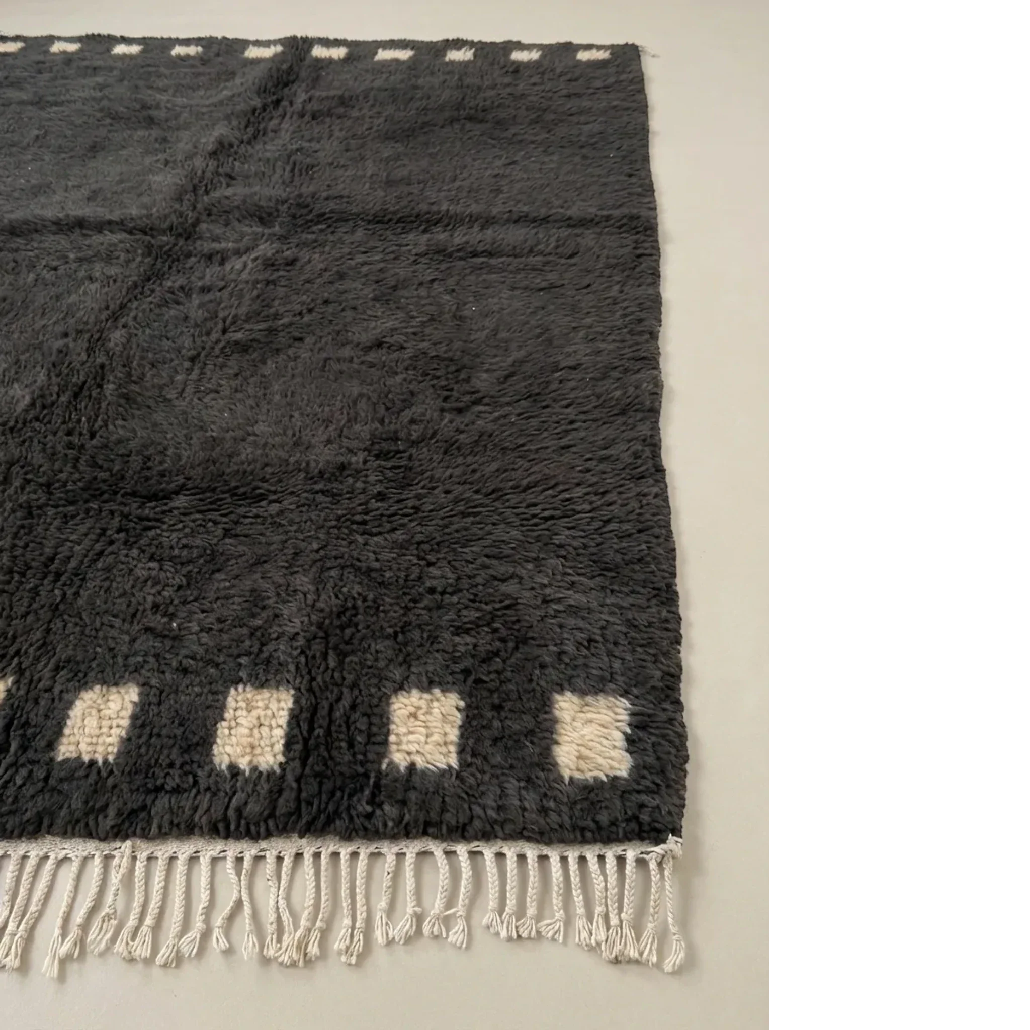 Soft natural wool pile detail of the Amanar charcoal Moroccan rug.