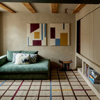Beige Zanafi rug Amerzgane with multicolor grid in a modern living room