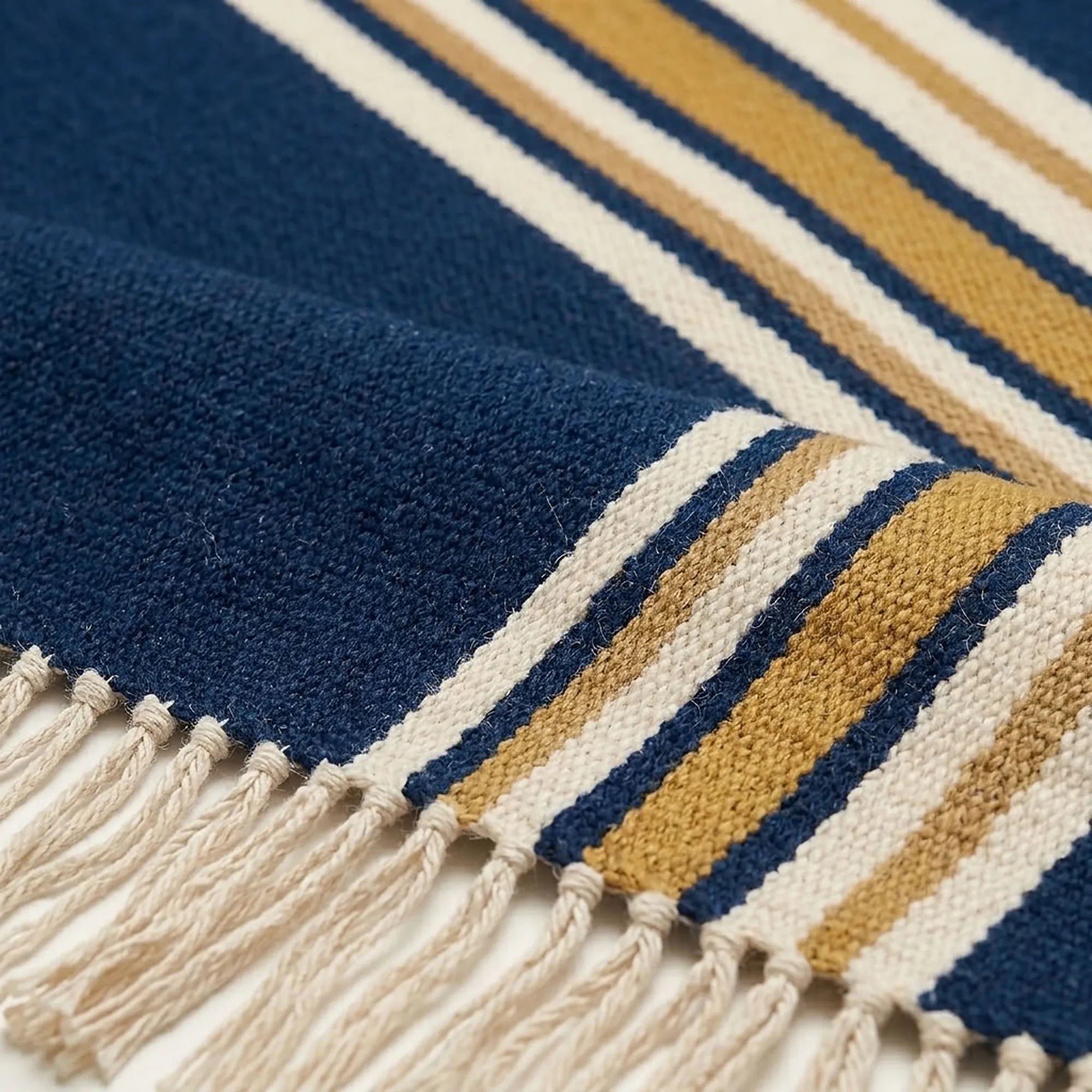 Navy, ivory and ochre Zanafi rug Amlen with side stripe design, border and fringe detail