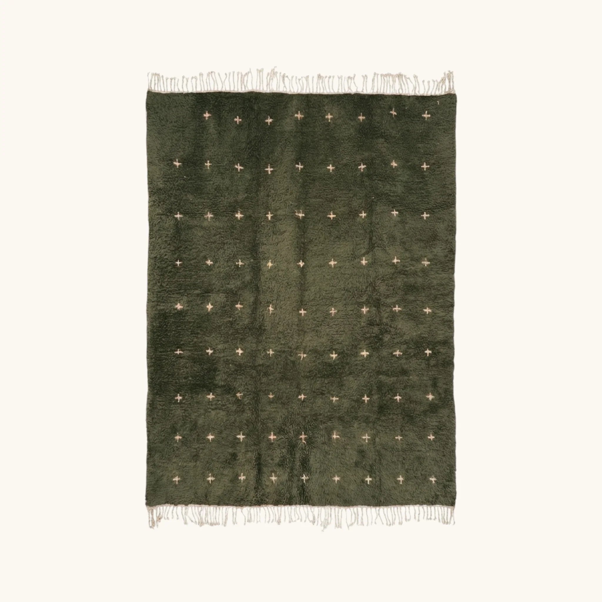 Full view of the Amnay green Beni Ourain rug with small ivory cross motifs.