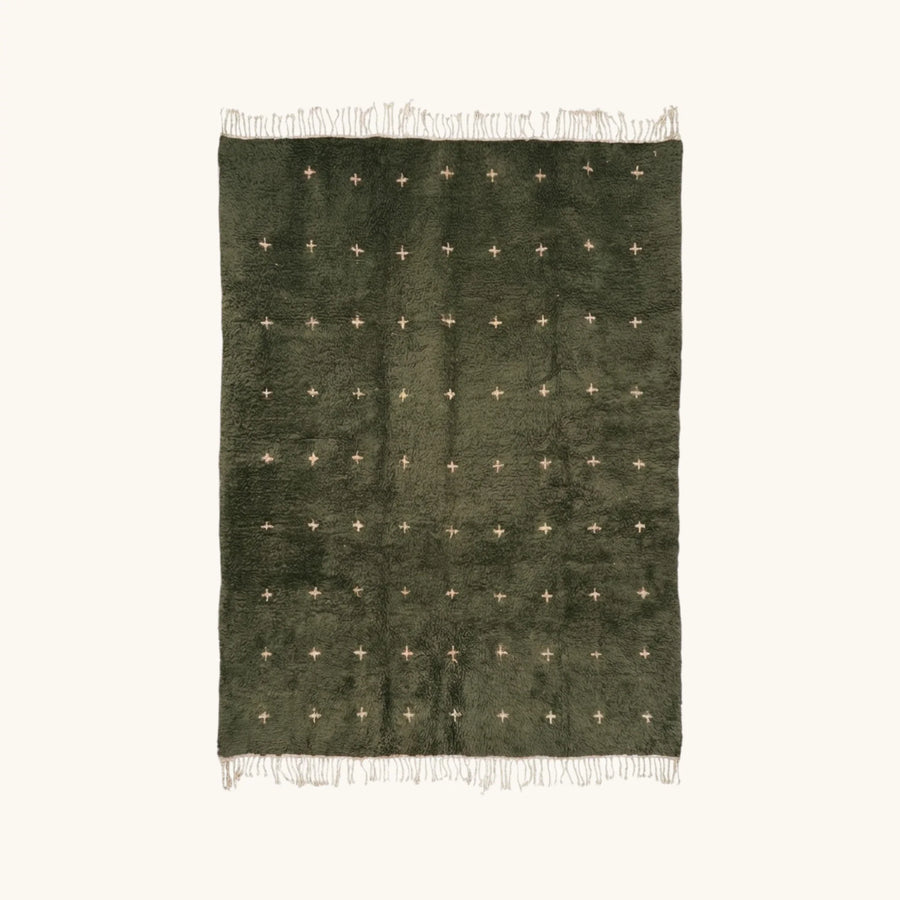 Full view of the Amnay green Beni Ourain rug with small ivory cross motifs.