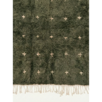 Detailed view of the ivory cross motifs across the Amnay green Moroccan rug.