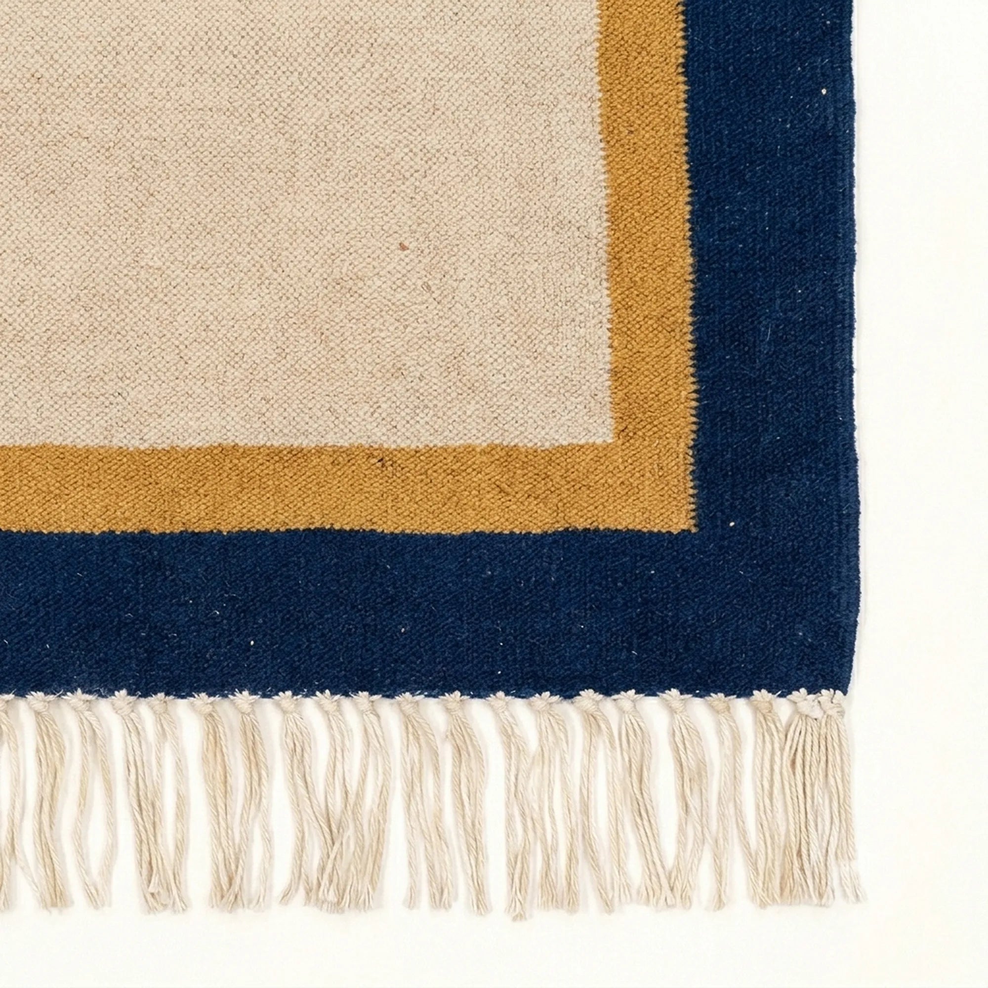 Ivory, navy and ochre Zanafi rug Aqqa with double border design, border and fringe detail