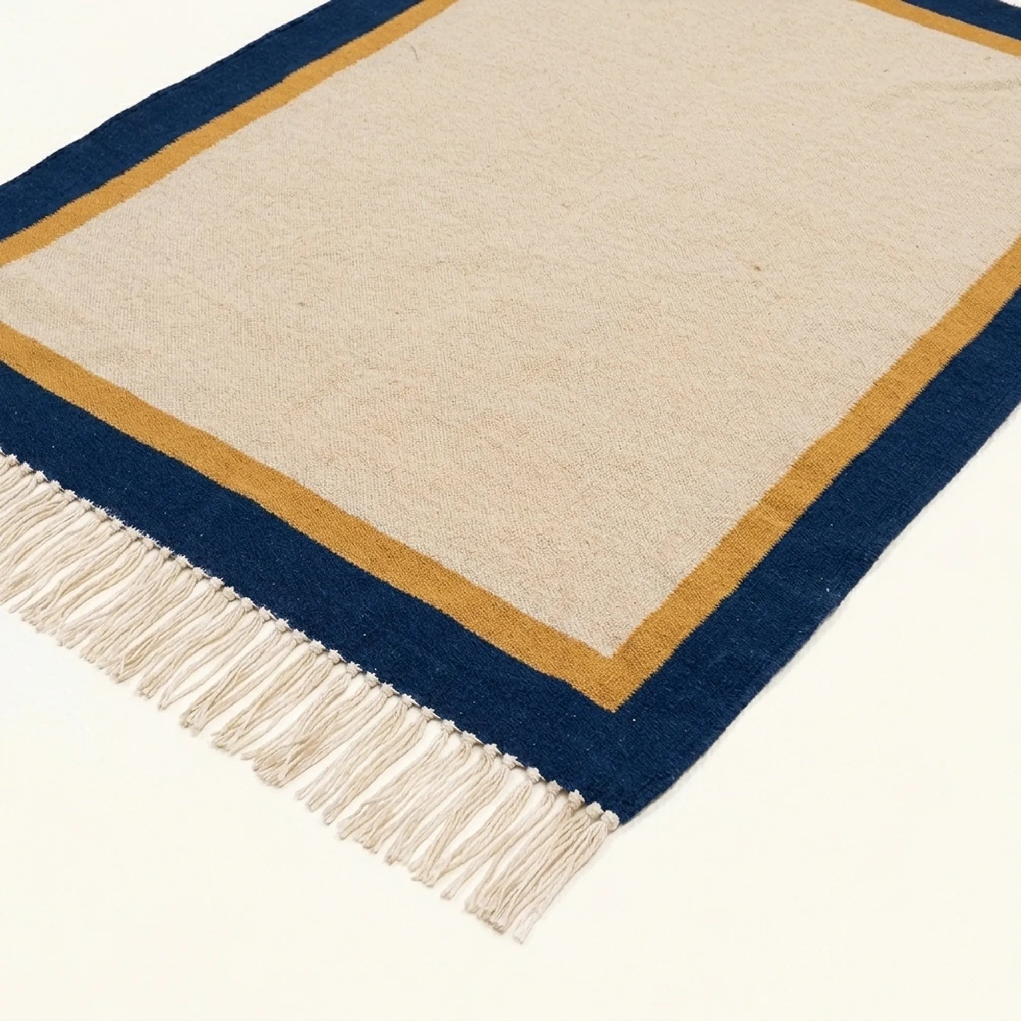 Ivory, navy and ochre Zanafi rug Aqqa with double border design, weave and fringe detail