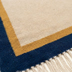 Ivory, navy and ochre Zanafi rug Aqqa with double border design, additional border detail