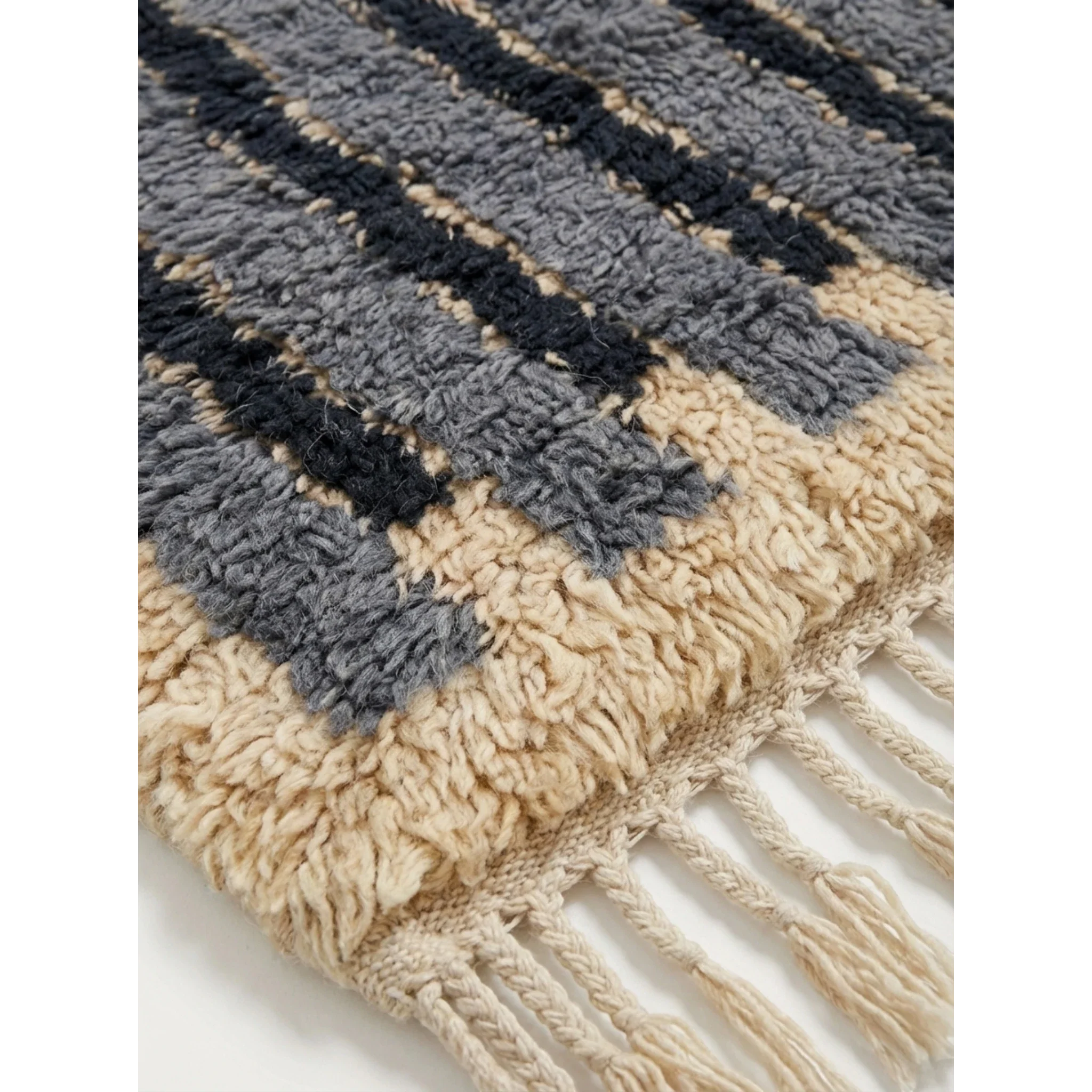 Close-up of the blue and ivory linear pattern on the Asif Moroccan rug.