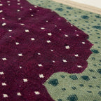 Plum Zanafi rug Asni ivory dot and mint motif detail