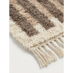 Hand-tied fringe and wool pile detail of the Aylal taupe rug.