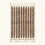 Full view of the Aylal taupe Beni Ourain rug with minimalist stripes and hand-tied fringe.