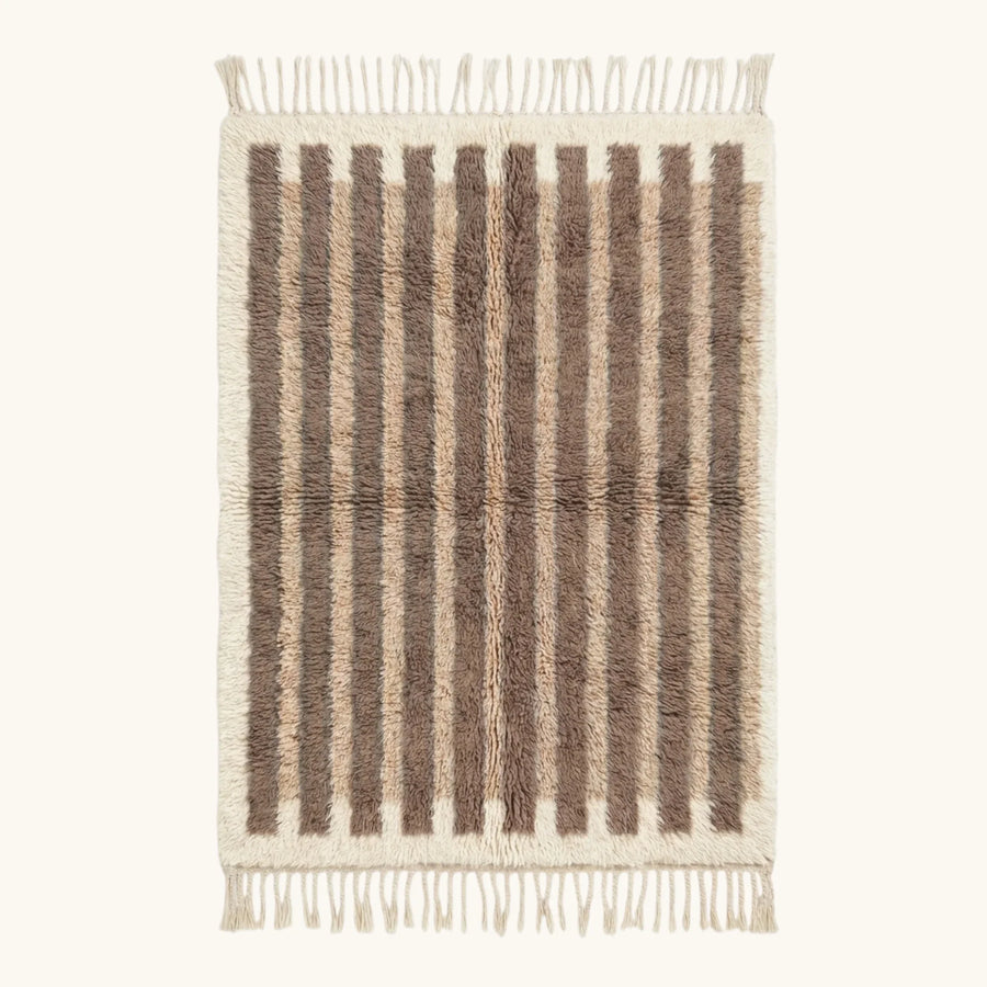 Full view of the Aylal taupe Beni Ourain rug with minimalist stripes and hand-tied fringe.