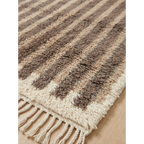 Natural wool texture detail of the Aylal taupe Beni Ourain rug.