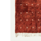 Full patterned surface and hand-tied fringe of the Azru terracotta Moroccan rug.