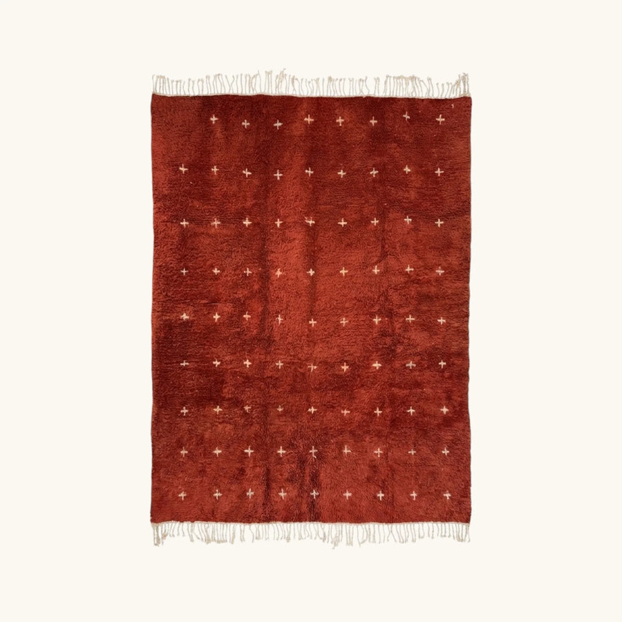 Full view of the Azru terracotta Beni Ourain rug with small ivory cross motifs.