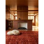 Azru terracotta Beni Ourain rug styled in a warm modern Moroccan interior.