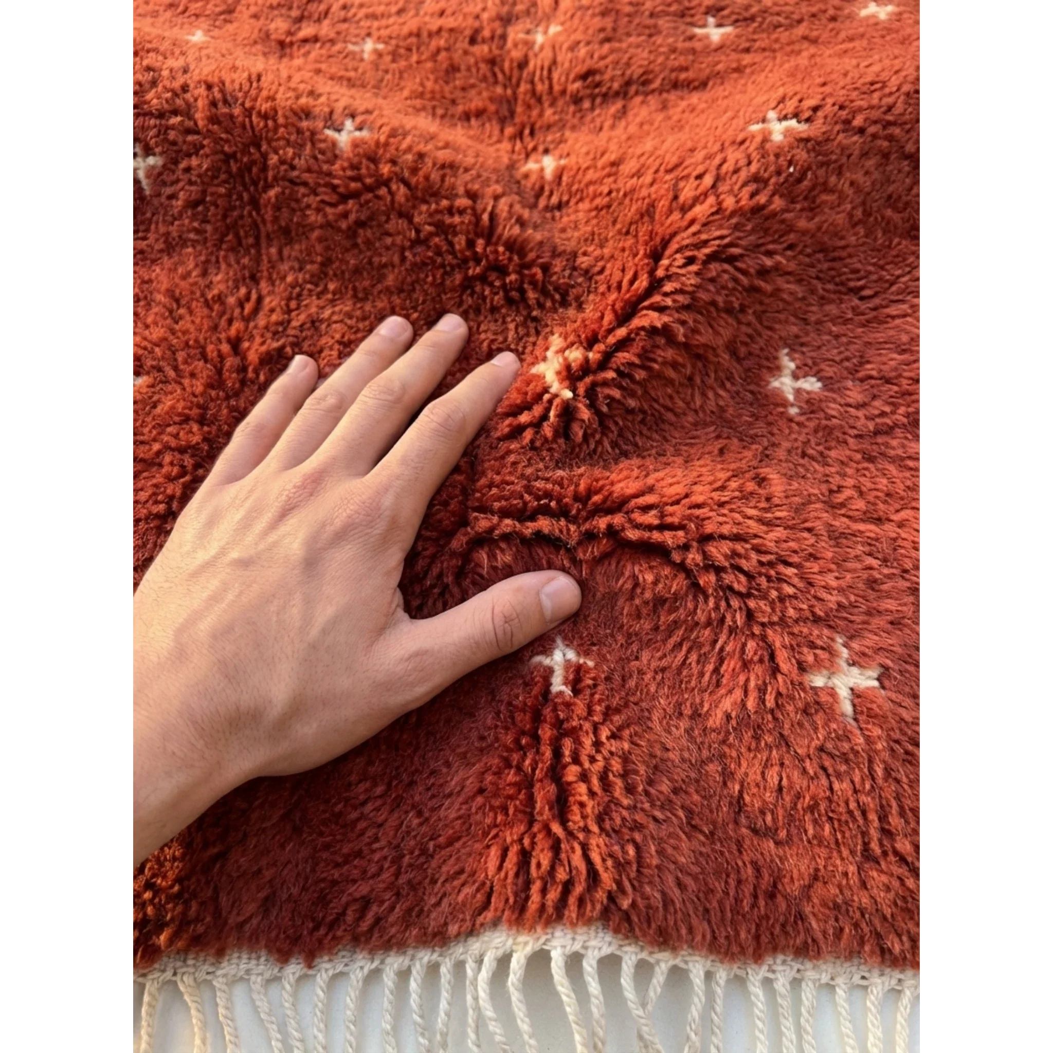 Soft natural Atlas wool pile of the Azru terracotta Moroccan rug.