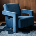 Azul navy blue Beni Ourain rug styled beneath a sculptural blue armchair.