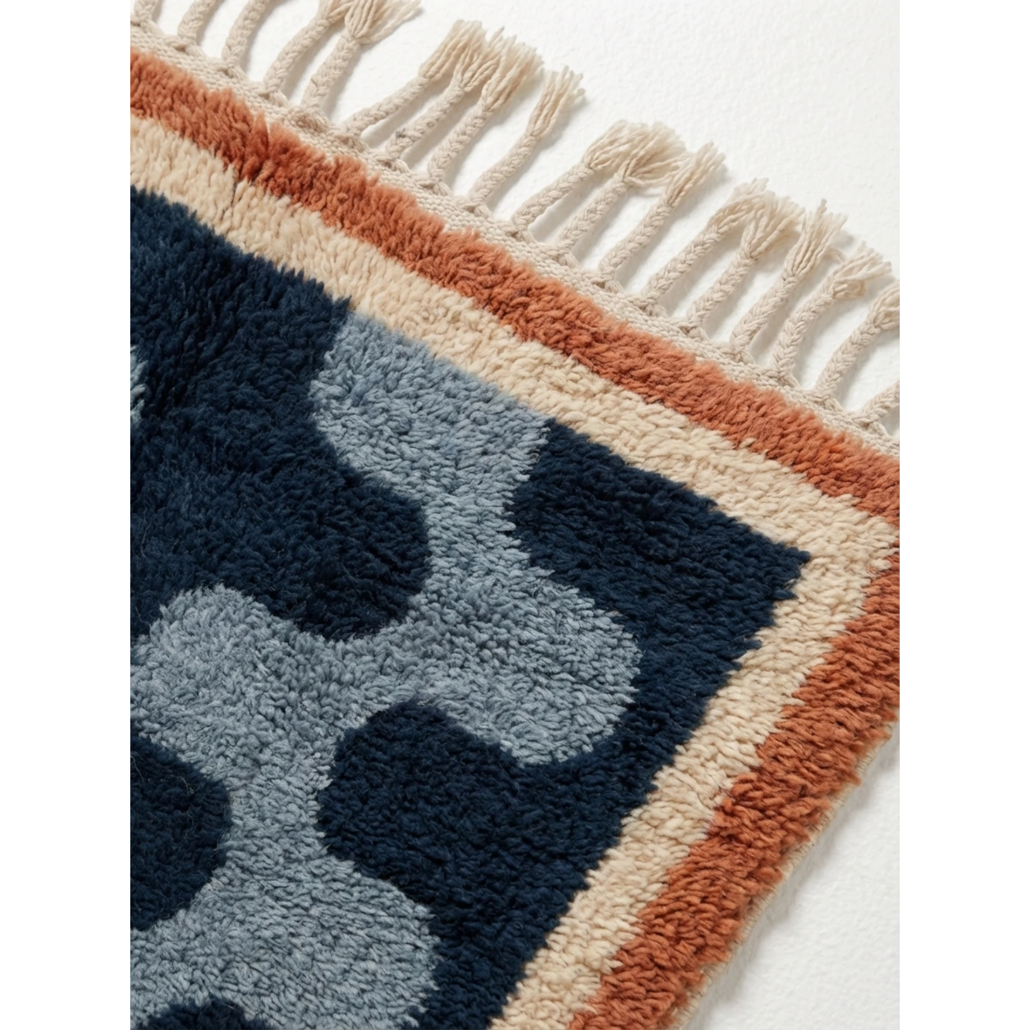 Border detail of the Azul Beni Ourain rug showing navy, powder blue, ivory and rust wool.