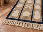 Fringe edge detail of the beige, cream and navy Mrirt runner with cream-coloured tassels