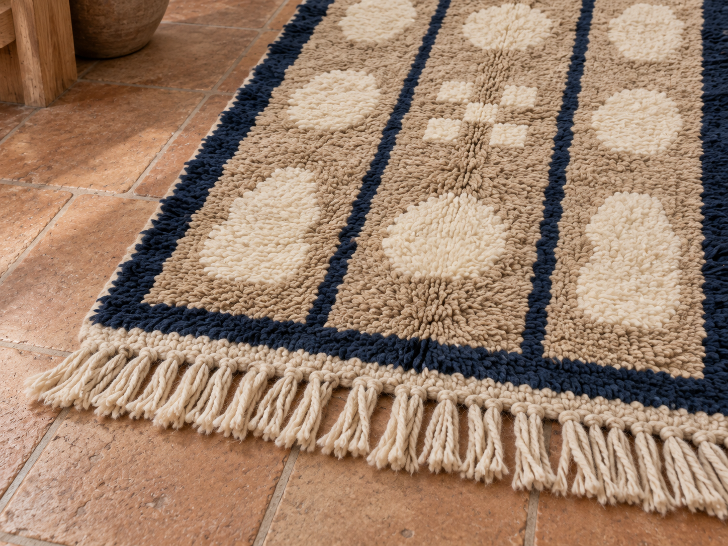 Fringe edge detail of the beige, cream and navy Mrirt runner with cream-coloured tassels