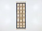 Beige, cream and navy Mrirt runner with three columns of ivory pebbles bordered in dark navy, flat view on white background