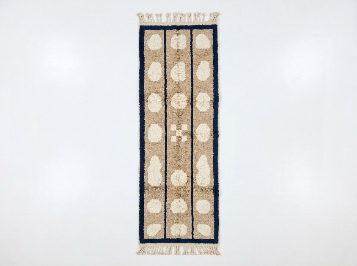 Beige, cream and navy Mrirt runner with three columns of ivory pebbles bordered in dark navy, flat view on white background