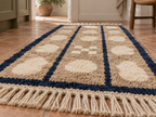 Beige, cream and navy pebble columns runner positioned in hallway with wooden furniture and neutral décor