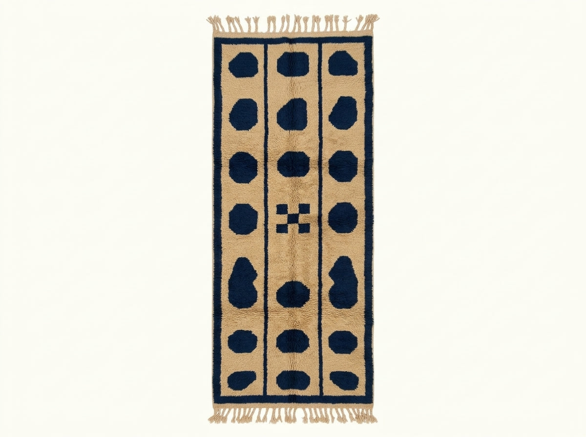 Beige and navy Mrirt runner with three columns of dark navy oval pebbles on a plain background, Tafukt design