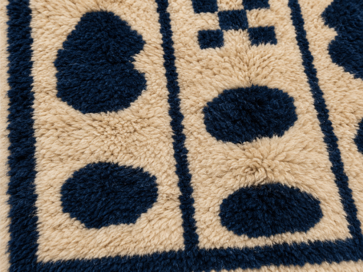 Detail of navy oval motifs and beige ground pile on Tafukt Mrirt runner