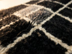 Detail of grid pattern intersection and wool weave on Tilelli runner corner