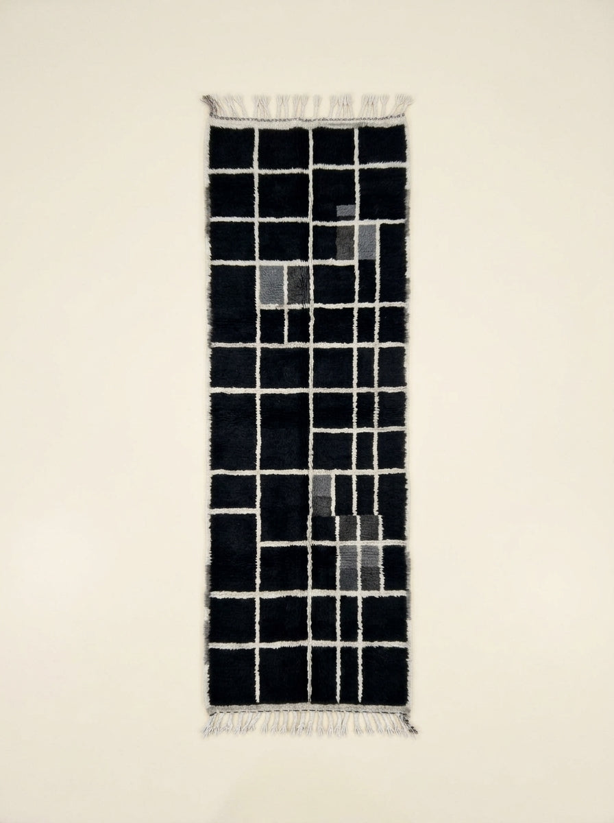 Black, charcoal and ivory Mrirt runner Tilelli with geometric grid check pattern, flat lay view