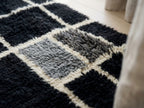 Close-up of plush knotted wool pile on Tilelli Mrirt runner showing black and ivory colours