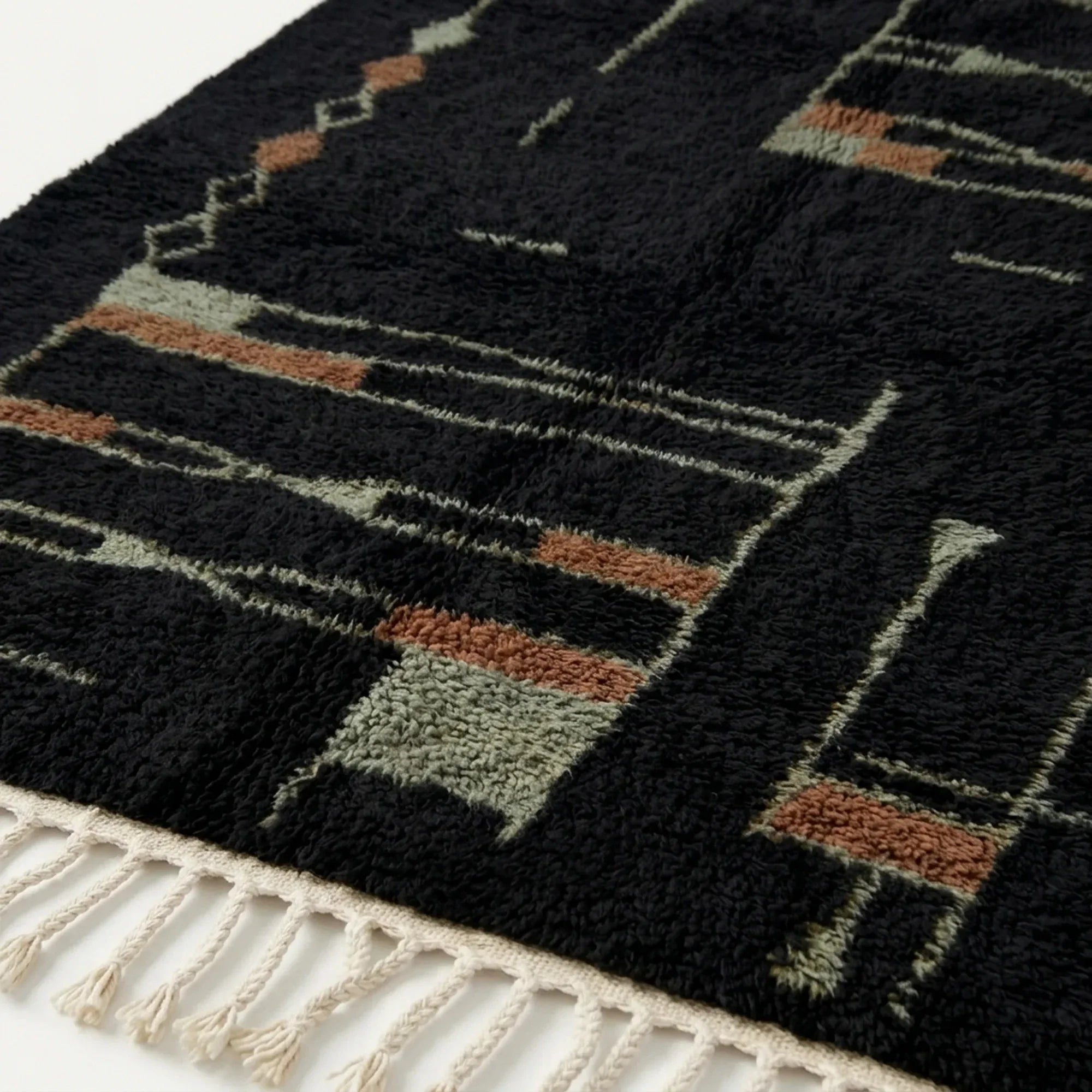 Close-up of the abstract linear pattern on the Aghbal rug.