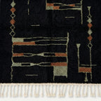 Angled view of the Aghbal hand-knotted Beni Ourain rug.