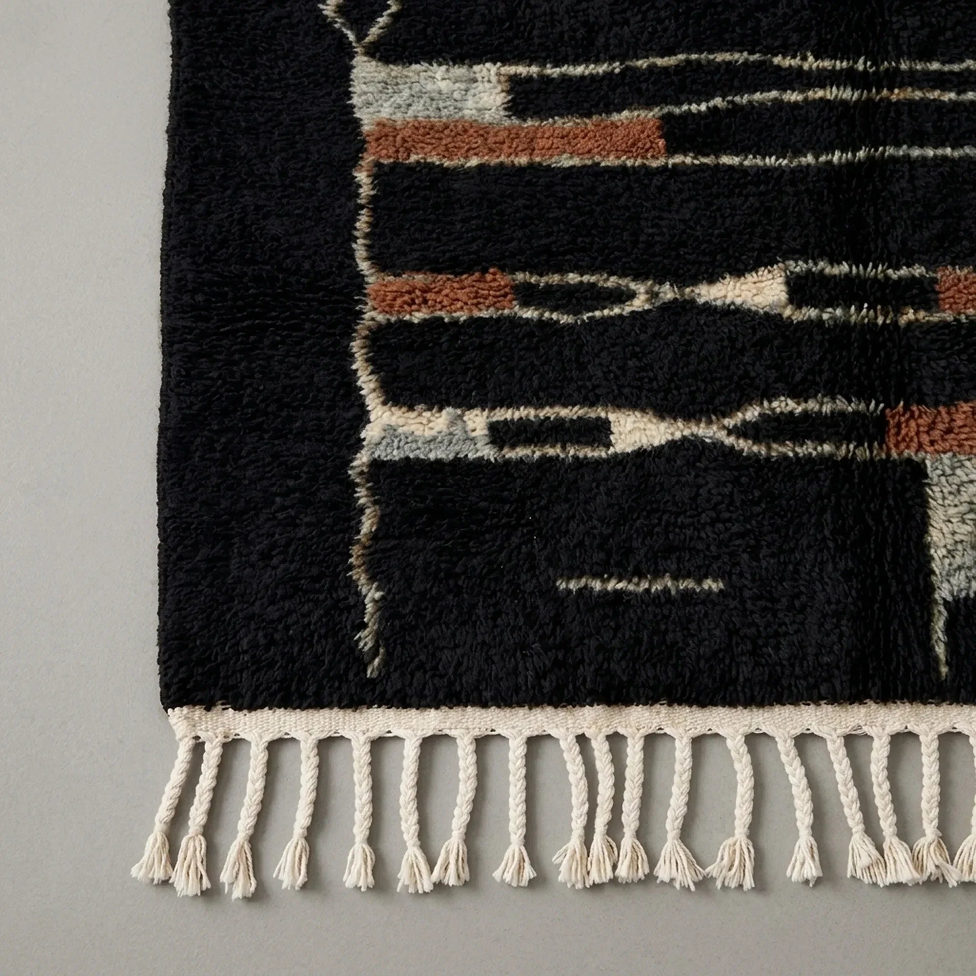 Close-up of the natural Atlas wool texture on the Aghbal rug.